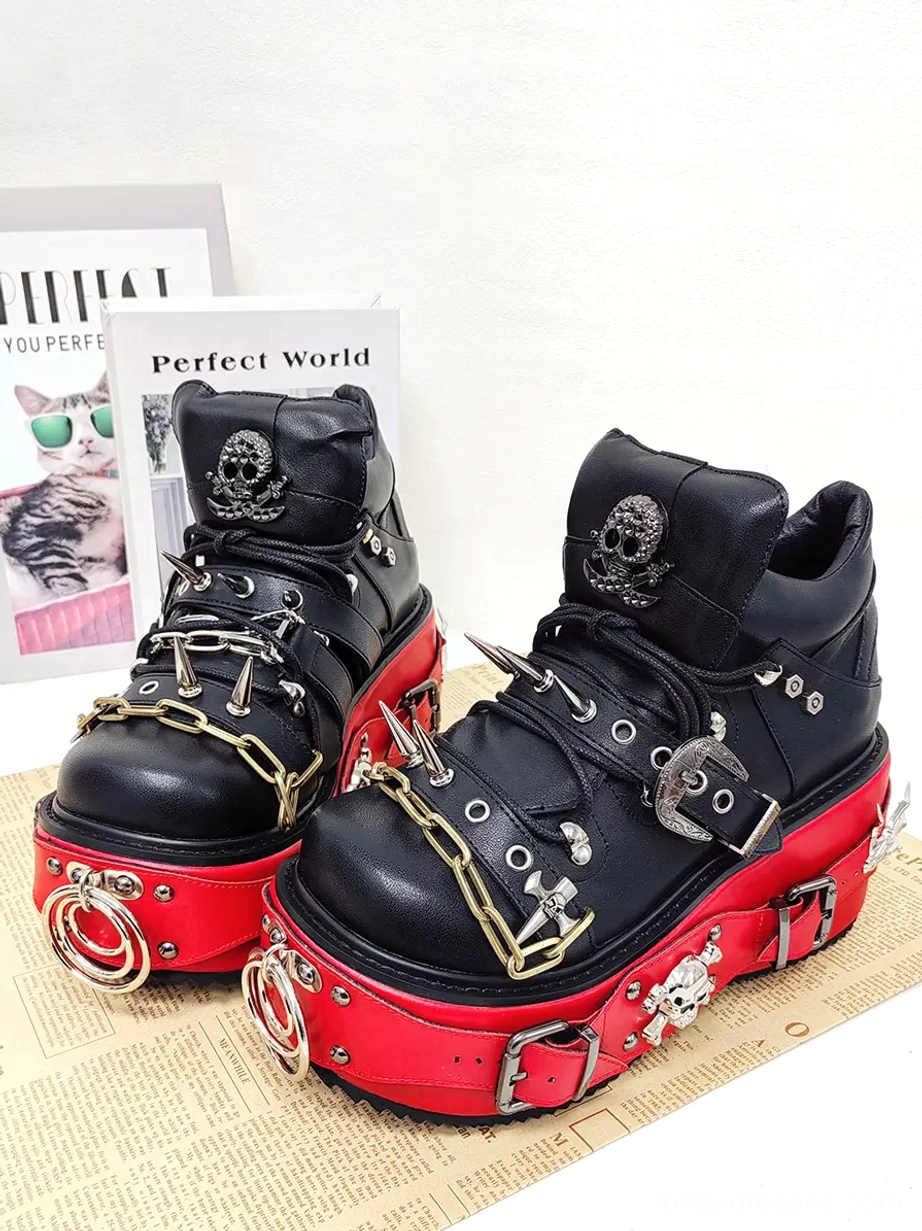 Paired gothic lolita punk platform boots front-side display with poster props chains spikes and skull motifs black rivets round toe design