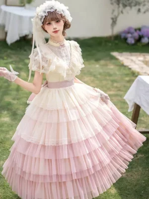 Pastel pink yellow ombre gradient fairy lolita op dress front view outdoor garden with tiered tulle skirt and ruffle short sleeves