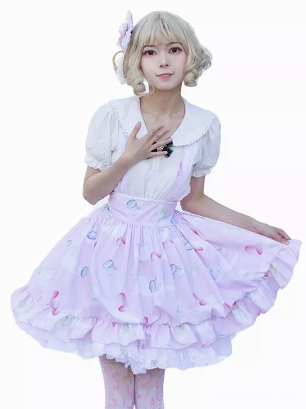 pastel pink printed lolita skirt three-quarter front view studio setting double ruffle lace hem black bow brooch