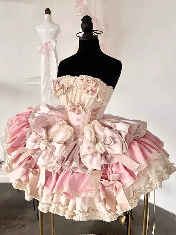 Pastel pink sweet lolita bunny ear fairy dress front view on dress form with satin bows ruffles and spaghetti strap bodice