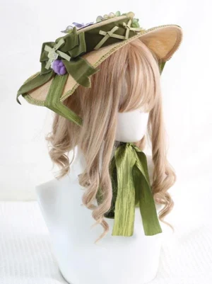 Pastoral lolita straw hat left three-quarter view with green ribbons and flower ornaments on mannequin