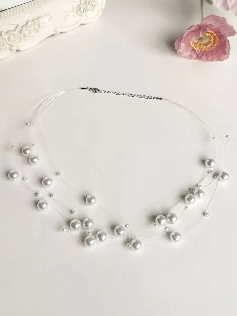 Pearl cluster choker necklace with silver-toned chain and clustered pearl decorations on white background with pink flower, coordinate accessory for Lolita dress