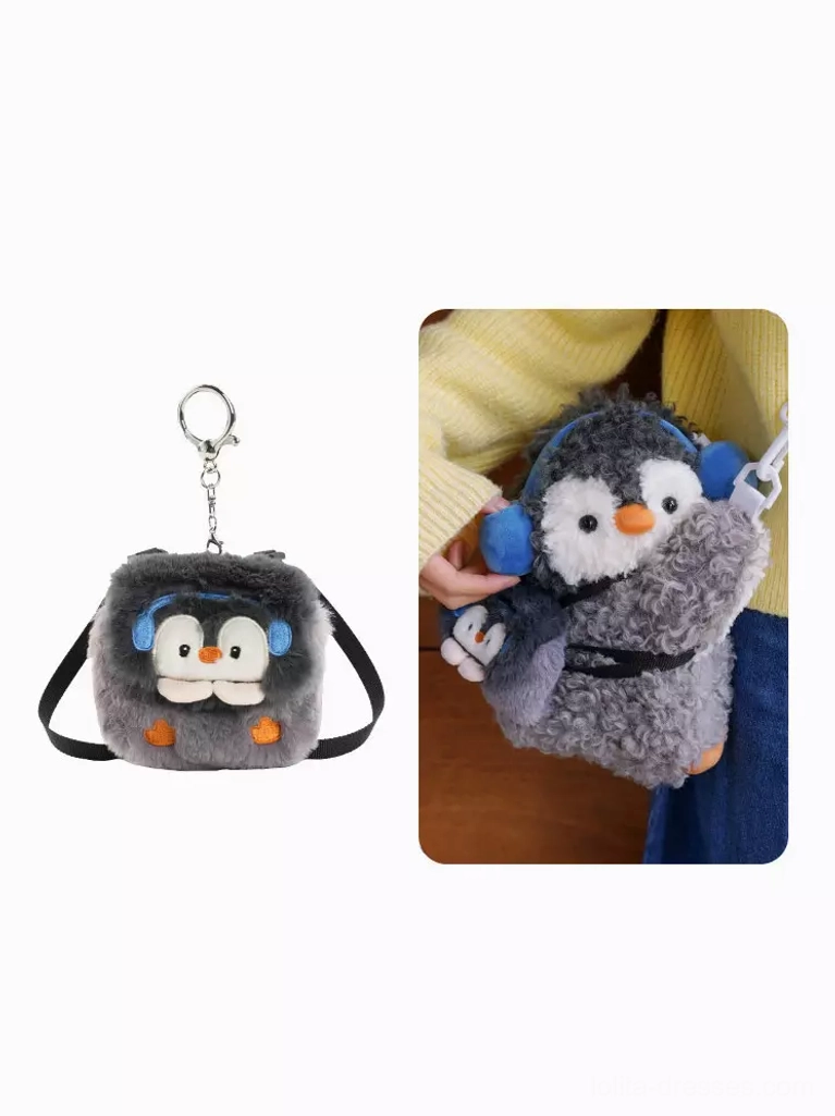 mini penguin coin pouch and full-size crossbody bag flat lay display with keychain loop blue earmuffs cute kawaii accessories