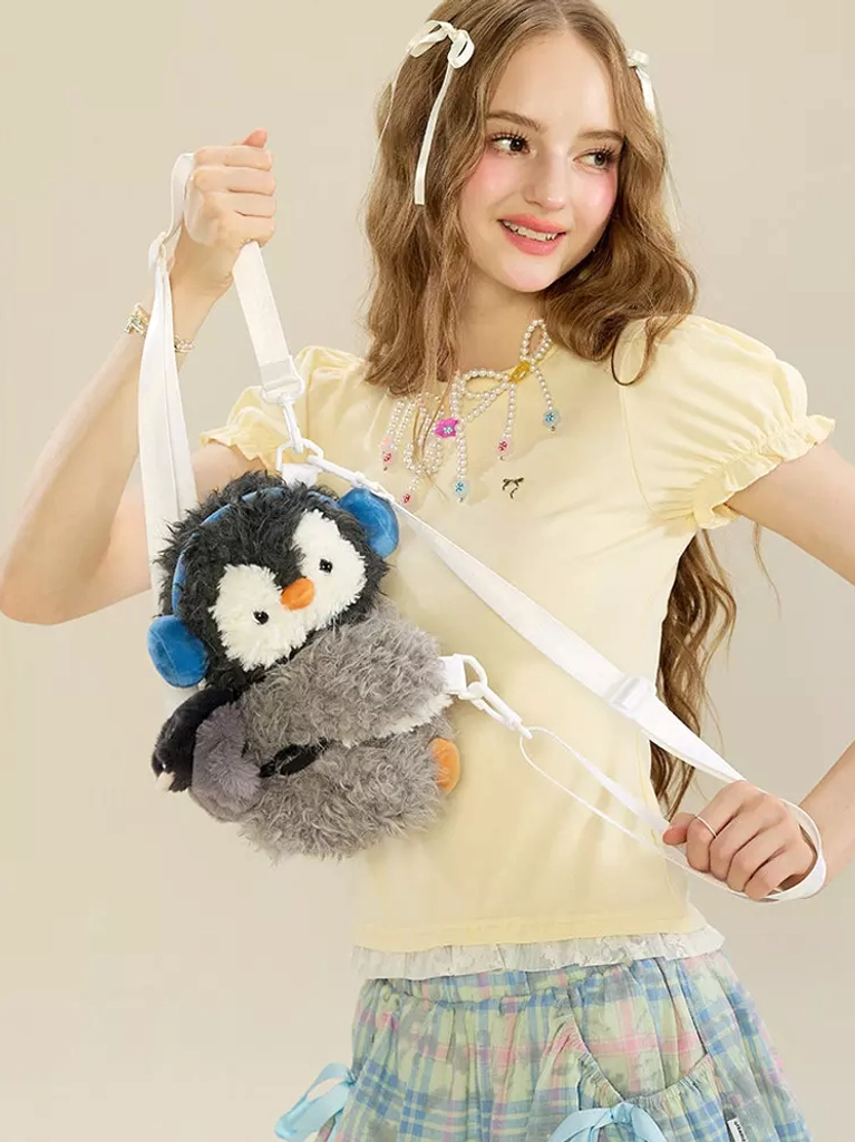 three-quarter front model view penguin plush bag yellow ruffled top plaid skirt kawaii lolita coordinate styling