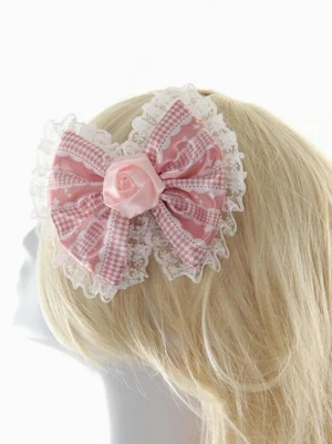 Lolita bow hair clip rear side angle view showing lace trimmed border pink checkered satin design on mannequin head