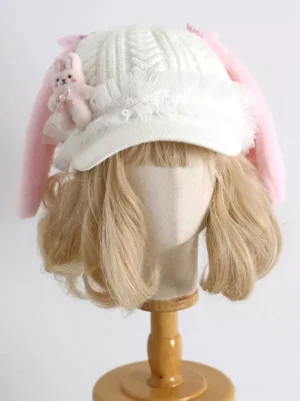 Pink bunny ear knit beret sweet lolita headdress front view flat lay white knitted fabric fuzzy pink ears lace trim plush rabbit decoration