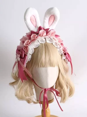 Sweet lolita bunny ear headdress three-quarter angle view showcasing lace ruffles, burgundy satin decorative bows, and pink inner ear details on styled mannequin