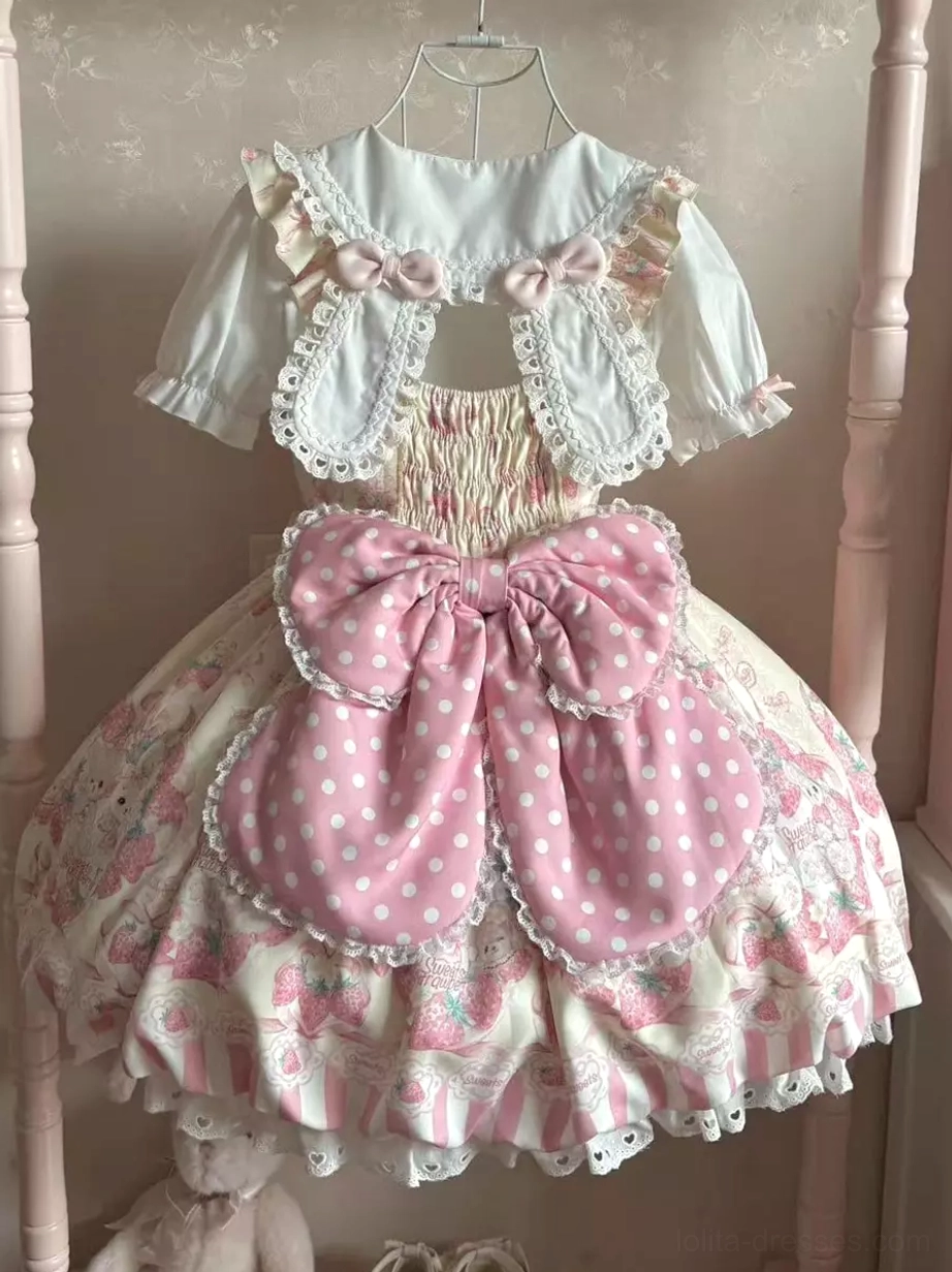 Pink bunny lolita dress back view display on bed frame large polka dot pink back bow shirred back panel sleeveless design rear silhouette aesthetic