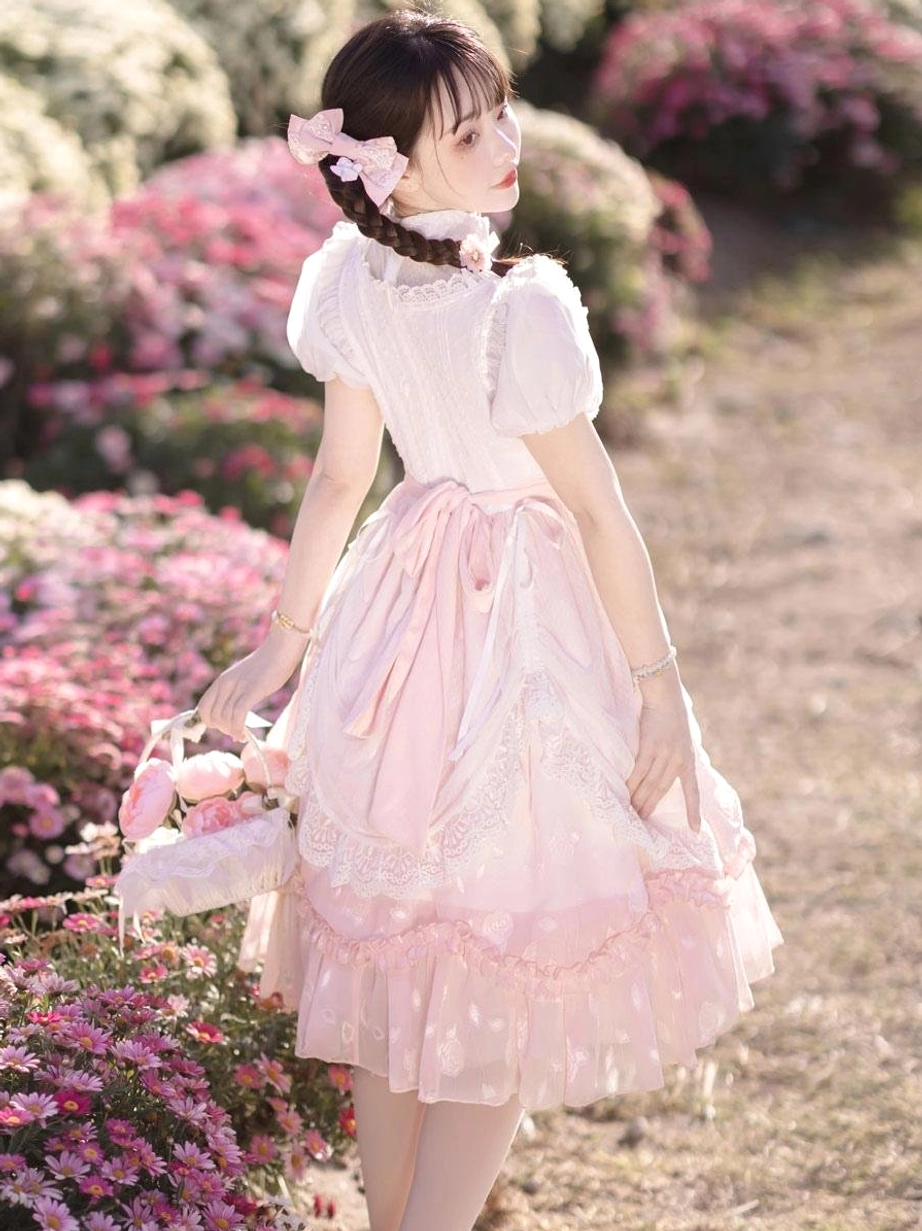 Pink classical lolita dress back side full view large waist bow sheer ruffled skirt hem flower path