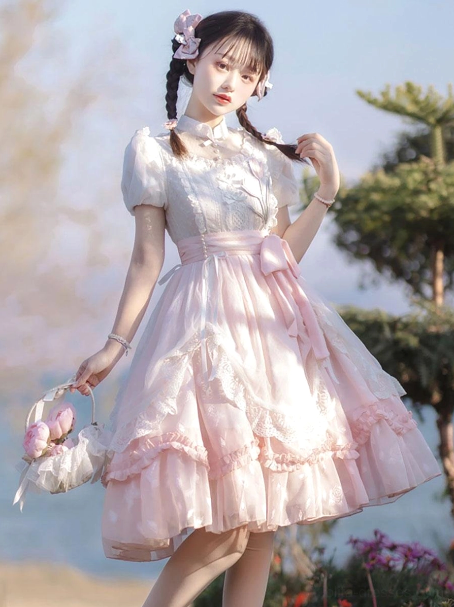Pink classical lolita dress full side three-quarter view puff short sleeves tiered ruffled skirt waterside garden