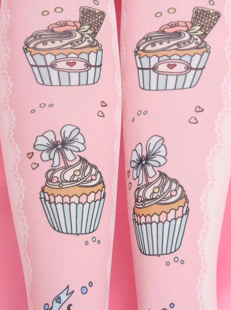 Close-up detail of pink Lolita socks showing cupcake with bow prints lace trim and decorative hearts dots accents