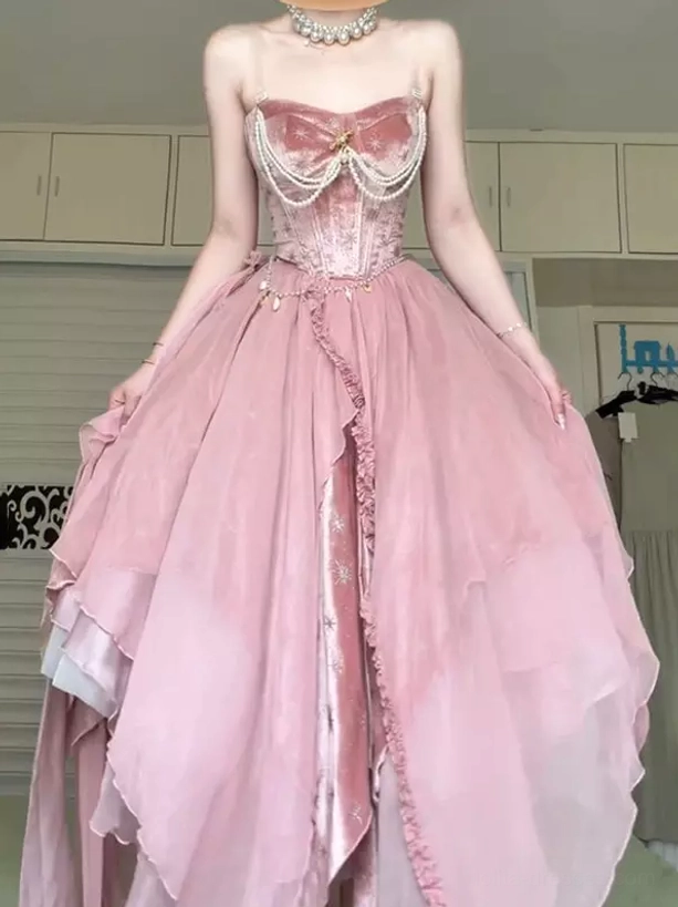 Pink fairy lolita velvet corset maxi dress with pearl chain detailing and layered asymmetrical tulle skirt - front three-quarter view showing full silhouette and design details