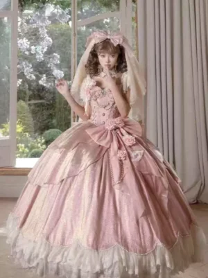 Pink fairy lolita wedding ball gown with large front satin bow and floral accents, white ruffled lace hem, sleeveless sweet lolita dress front view