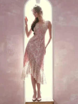 Pink floral fairy lolita slip dress with lace ruffle hem full body side view with spaghetti straps and irregular hem on model