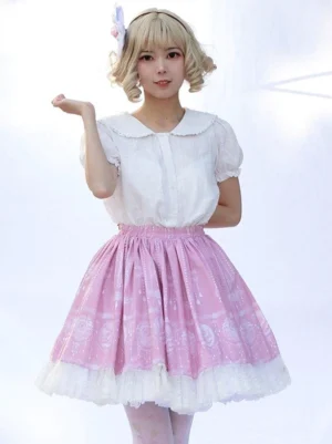 Pink floral sweet lolita skirt front full view with blonde model wearing white ruffled lace hem and floral print
