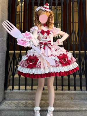 Pink sweet lolita dress front view with layered gingham skirt and prominent chest bow on model wearing matching pink coordinate