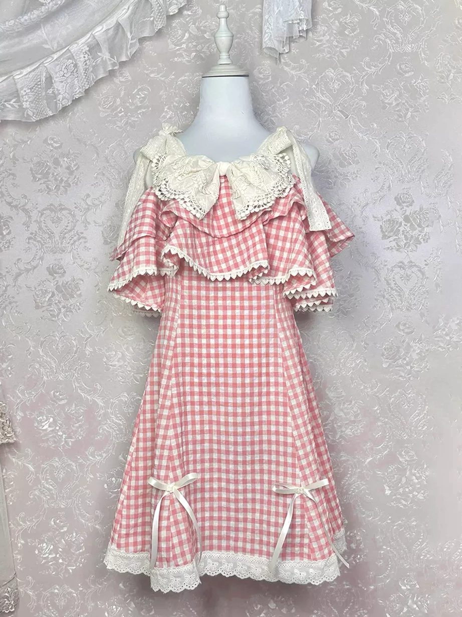 Pink white gingham Sweet Lolita mini dress flat hanging display front view tie-on shoulder straps lace bow collar side hem bows