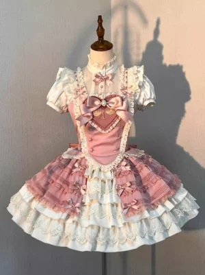 Pink sweet Lolita dress full front view with puff short sleeves, multi-layer ruffled skirt, and heart-shaped front decoration displayed on dress form