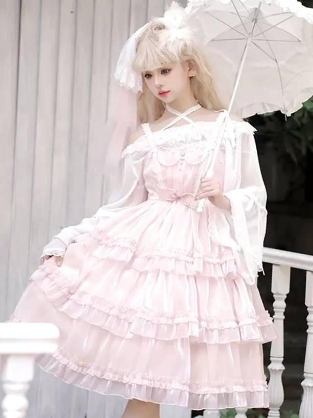 Pink sweet Hime Lolita dress full length front view with decorative waist bow, off-shoulder design, and tiered ruffled skirt, styled with white parasol on balcony