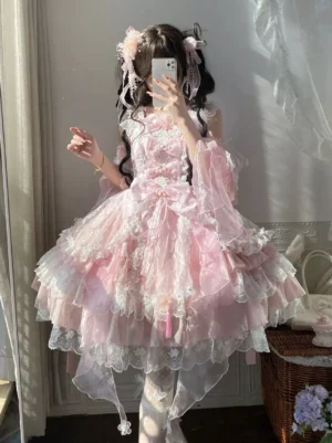 Pink Hime Lolita JSK dress front mirror selfie view showcasing detachable flounce sleeves and statement bow sweet lolita aesthetic