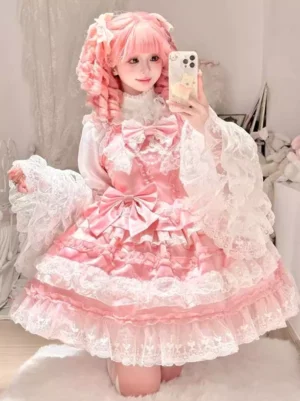 Pink Hime Lolita jumper dress with white lace inner blouse and flared sleeves, sweet lolita aesthetic bedroom setting