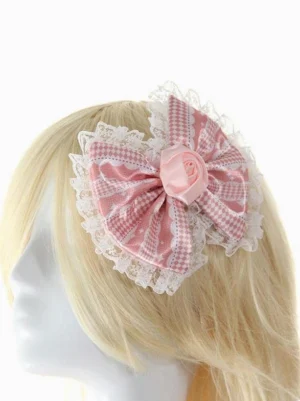 Pink lace bow lolita hair clip with white ruffled lace trim and rose center detail on blonde mannequin head frontal view elegant headdress accessory