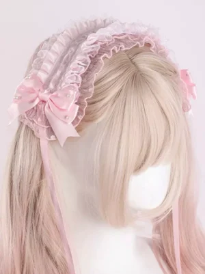Pink lace ruffled Lolita wedding headdress with satin bows and pearl accents, side angle view worn on blonde wig mannequin, showing delicate layered ruffles and flowing ribbon details