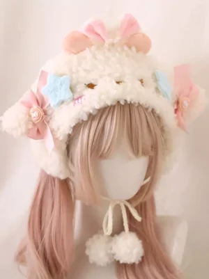 Pink lamb ear sherpa bucket hat worn on mannequin with twin tails, featuring cream fleece, pink decorative bows, embroidered star ornaments, and white pompom chin straps - classic lolita headdress accessory