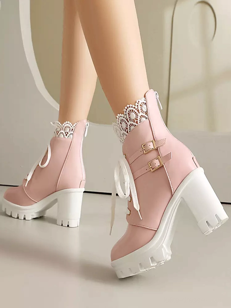Pink PU leather Lolita high-heeled ankle boots side oblique worn feet view with white platform sole and decorative buckles