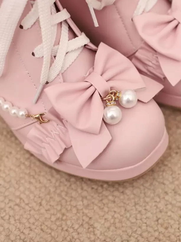 Pink lolita ankle boots close-up top view big bow pearl pendants PU leather ruffle lace embellishments detail