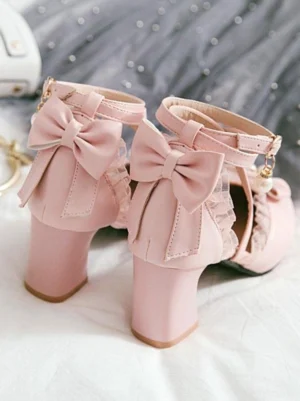 Pink Lolita block heel pumps top-down flat lay featuring large back bow, delicate lace trim detailing, and ankle strap design