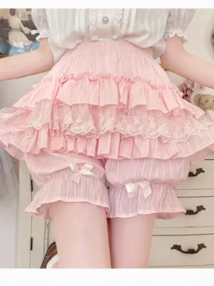 Pink sweet lolita bloomer shorts side angle showing layered ruffle lace trim and elastic waistband with bow decorations