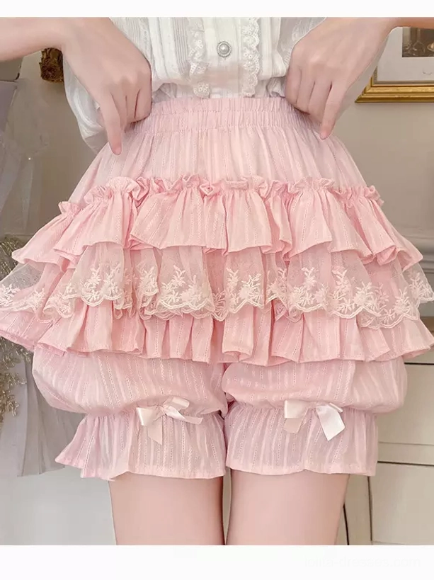 Pink lolita bloomers with tiered ruffles front view close-up featuring elastic waist and decorative bowknots on leg cuffs