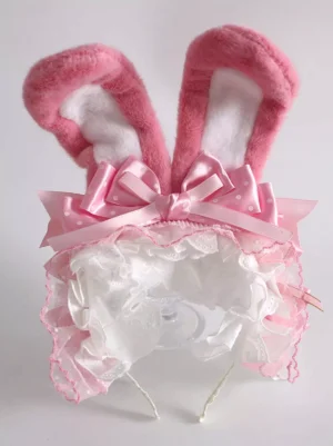 Pink bunny ear lolita headdress with ruffled lace trim and satin bow flat lay detailed view