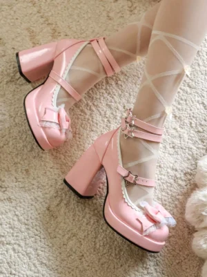 Pink lolita chunky heel pumps with ruffled trim and front bow, side top angle view showing thick platform heel and fuzzy carpet setting