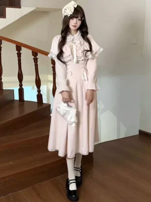 Classic pink lolita midi dress with bow details and white handbag accessory indoor staircase setting