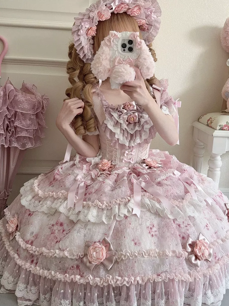 Pink lolita dress mirror selfie front view corset bodice satin ribbon decorations matching flower bonnet close-up details