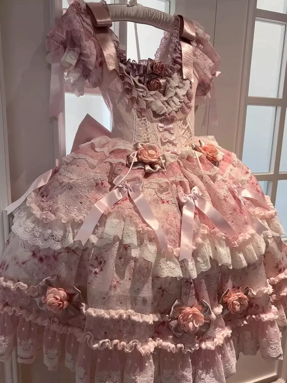 Pink floral lolita dress front close-up on hanger square neckline tiered lace skirt satin bows 3D roses detailed shot