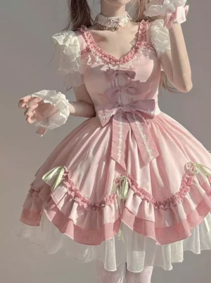 Close-up detail of pink Lolita dress showing lace choker neckline, layered ruffled neck trim, and tiered skirt ruffles with delicate embellishments