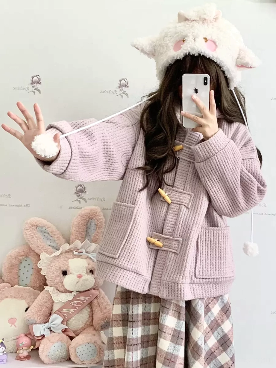 blush pink waffle knit rococo lolita hooded coat side front view with patch pockets and horn toggle closures worn with plaid coordinate
