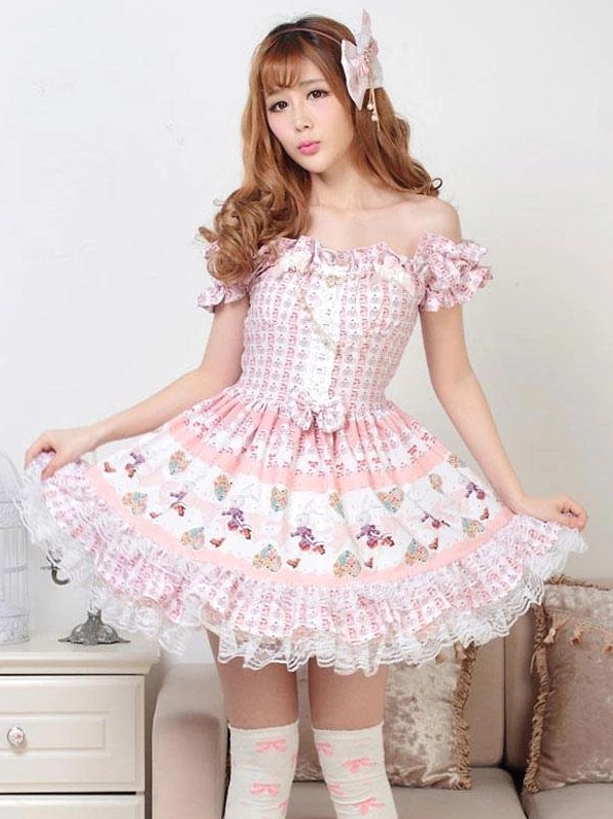 Pink classic lolita OP dress with full ruffled lace skirt edge off-shoulder ruffled sleeves front view holding hem
