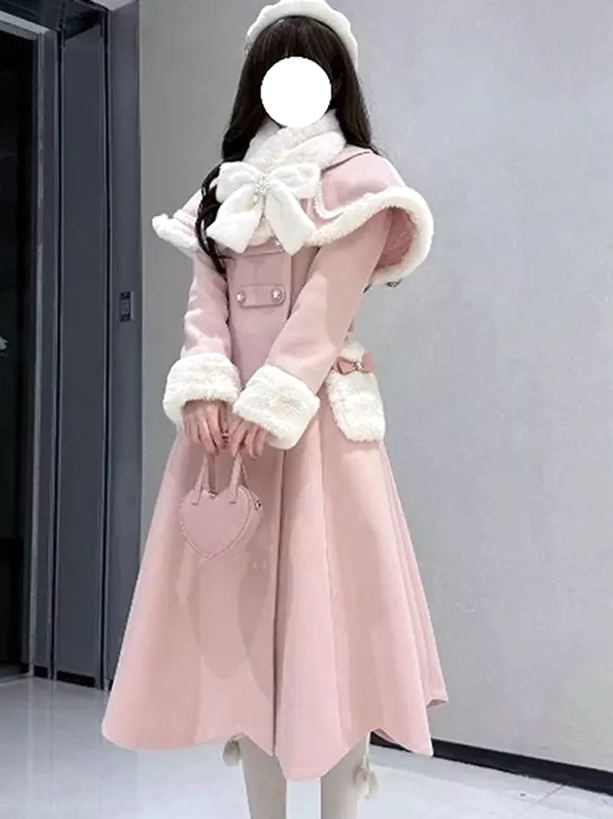 Pink lolita overcoat showing waist belt sash and fur-decorated pocket details, model holding pink heart-shaped handbag in corridor setting