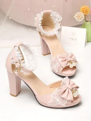 pink lolita high heel sandals with ruffled lace ankle strap pearl bow and peep toe flat overhead product shot tabletop styling