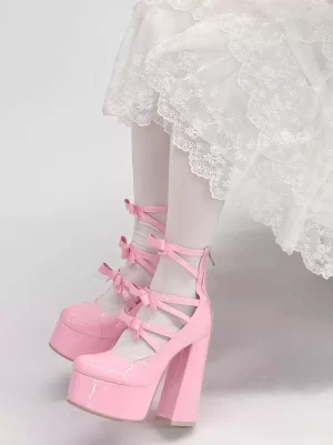 Pink Lolita platform boots side rear view displaying chunky block high heel, rear zipper closure, and white lace coordinating skirt with white stockings for sweet Lolita aesthetic