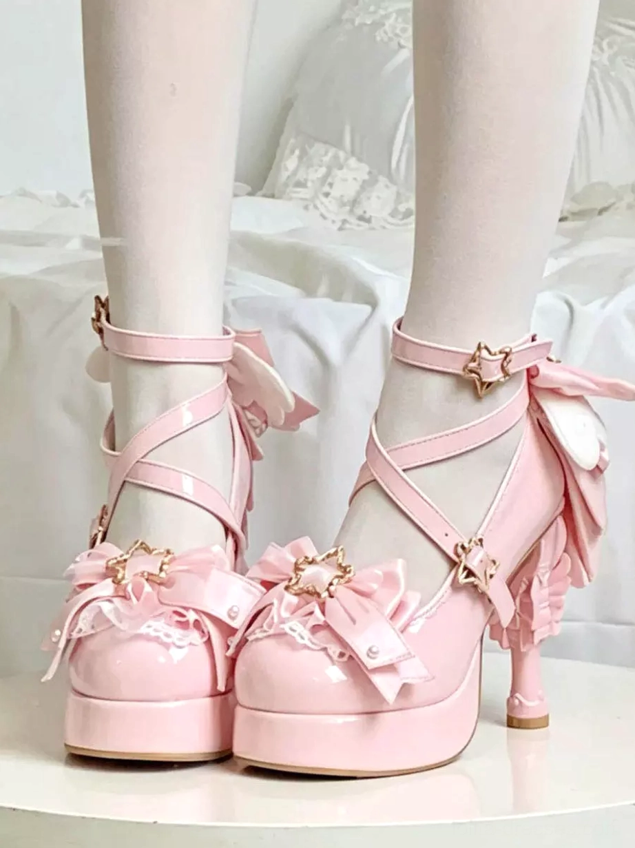 Soft pink pastel lolita platform heels with crisscross straps, front lace bows, star-shaped buckles, sweet lolita aesthetic, on white bedding
