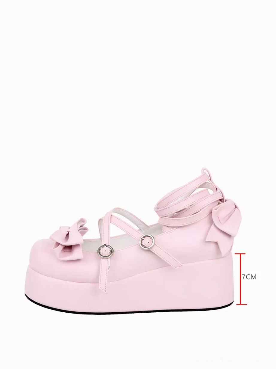 Single pink Lolita platform pump side view with height scale ruler showing 7cm thick chunky heel, metal buckle fasteners, baby pink color, and platform construction