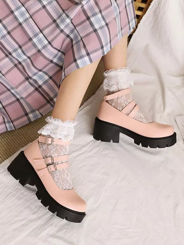 Pink lolita platform shoes low side angle view on model with pink plaid skirt and lace socks showing chunky outsole