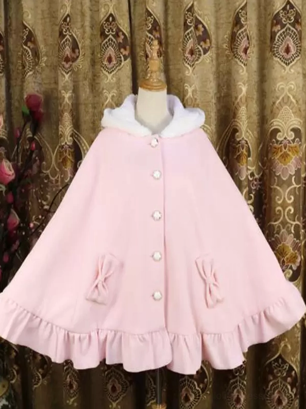 Pink Lolita poncho coat front full view featuring furry hood, pearl button closure, decorative bow trims, and dimensional ruffled hemline