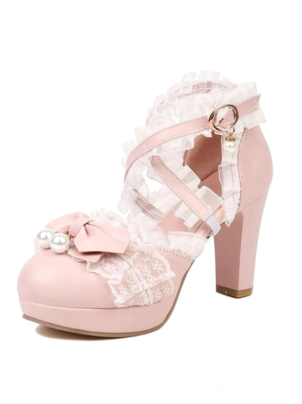 Single pink Lolita high heel pump front three-quarter closeup view with ruffled cross straps bow pearl accents buckle strap details