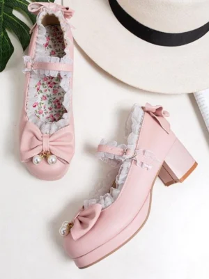 Pink sweet lolita pumps flat lay overhead view with pearl bow ruffled lace ankle strap round toe block heel PU leather
